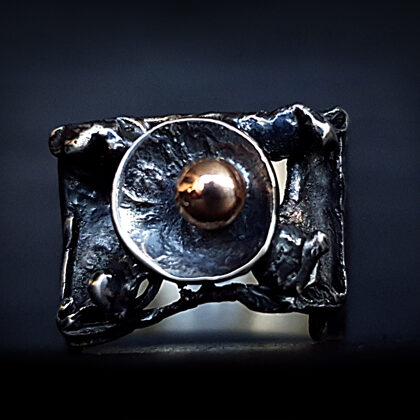 Oxidized silver ring with gold bead