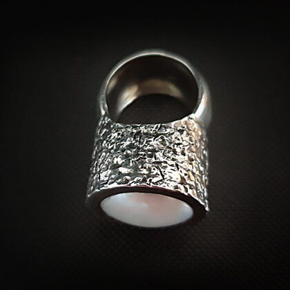Oxidized sterling silver ring with texture and white pearl